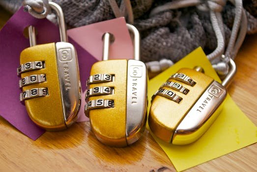 pexels-photo-943922-943922 Three gold combination padlocks with colorful tags, symbolizing security and travel.